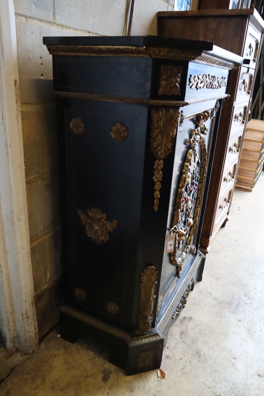 A Victorian ebonised gilt metal and hardstone mounted pier cabinet with black slate top, width 83cm, depth 44cm, height 110cm